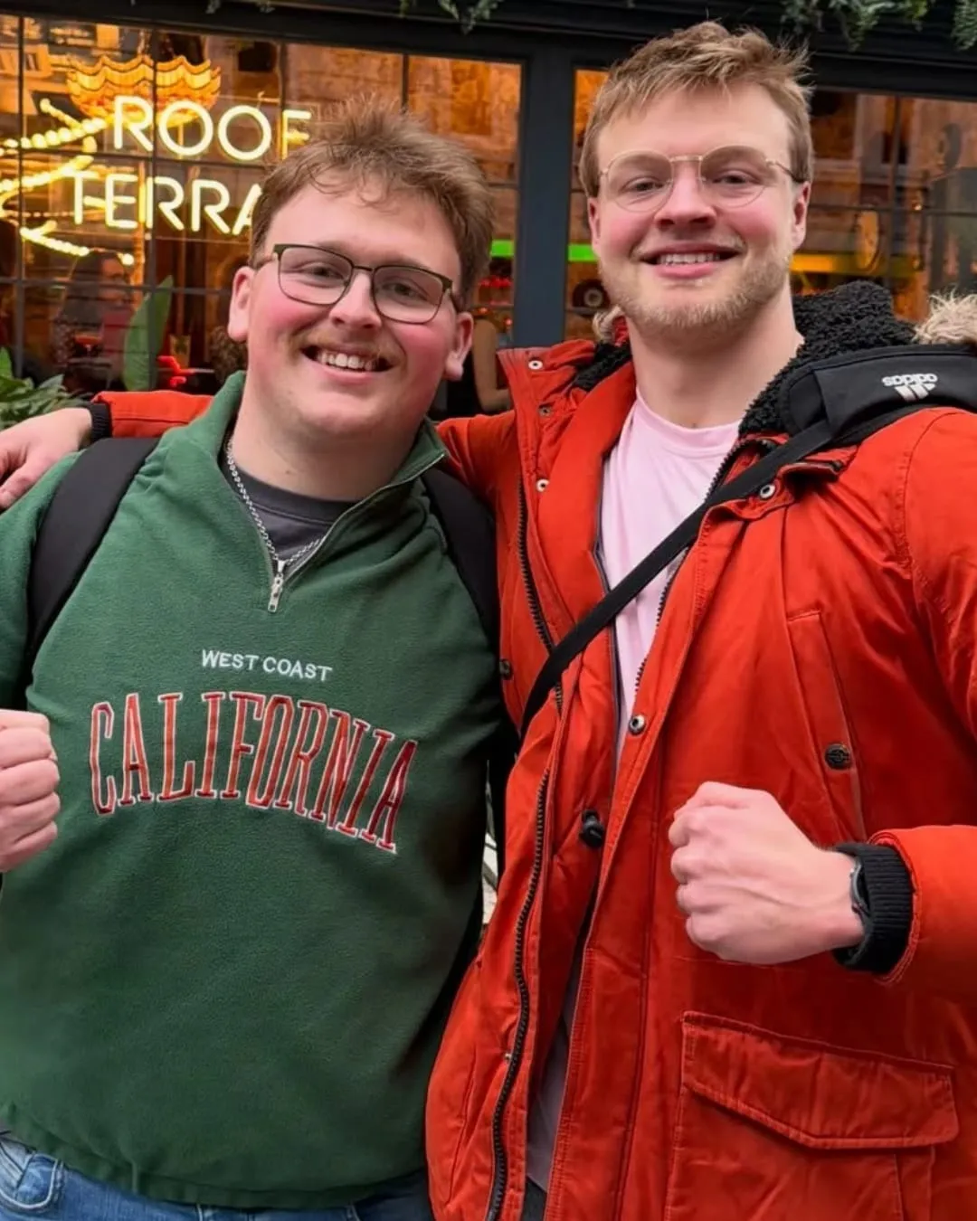 Charlie and Nathan out in town, arms around each other