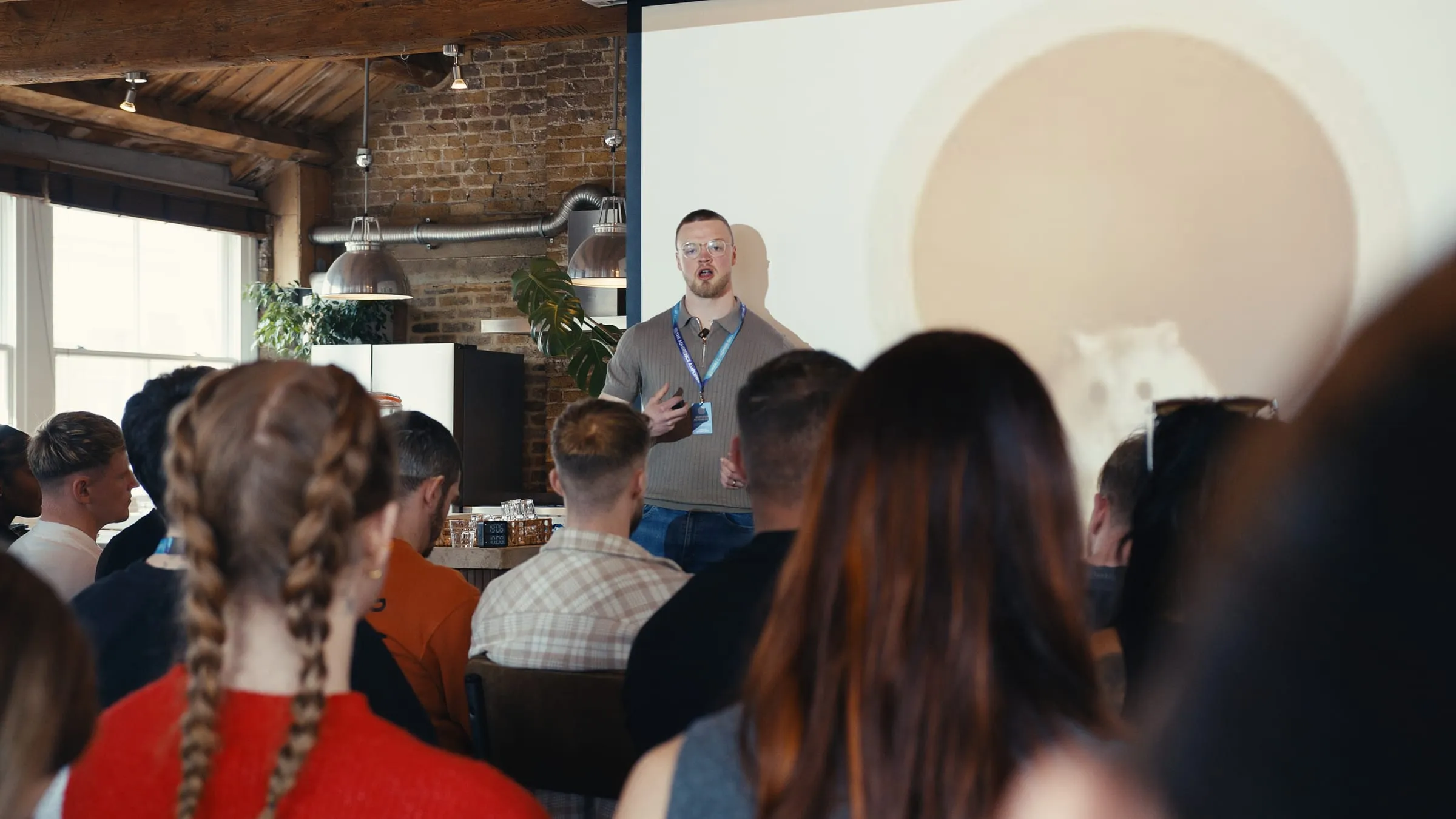 Nathan Keevil speaking to a seated audience at a Coached By Keevil seminar